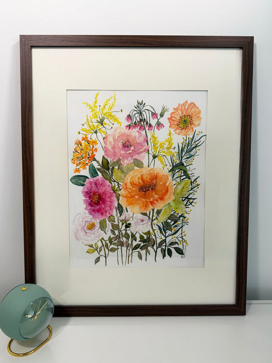 Framed watercolor original floral painting with pink, orange and yellow flowers, set in a Walnut wood grain frame with an off white mat. For sale by Art Like That.