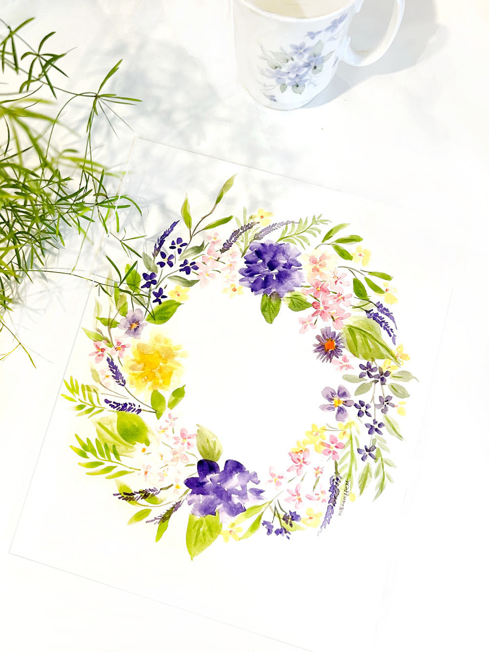 A very pretty floral original watercolour flower wreath, &nbsp;perfect for a little girl's nursery decor. &nbsp;Soft yellow, pink and purple flowers painted in a circle.